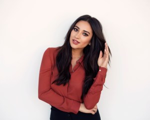 In this Oct. 6, 2015 photo, actress and author Shay Mitchell poses for a portrait in New York to promote her new book "Bliss," a novel she wrote with her best friend. Mitchell will also star in an upcoming film with Jennifer Aniston called, "Mother's Day." (Photo by Taylor Jewell/Invision/AP)