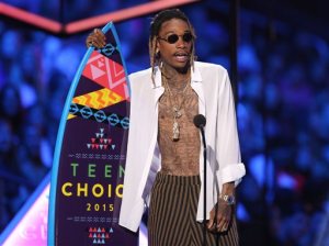 FILE - In this Aug. 16, 2015, file photo, Wiz Khalifa accepts the choice R&B/hip-hop song award for See You Again at the Teen Choice Awards at the Galen Center in Los Angeles. Pittsburgh police say rapper Wiz Khalifa has been cited for urinating in public. City public safety spokeswoman Sonya Toler says it happened at about 2:30 a.m. Saturday, Oct. 10, behind a bar called The Flats on Pittsburghs South Side. (Photo by Matt Sayles/Invision/AP, File)