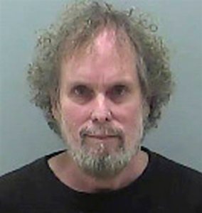 FILE - This undated file photo provided by the Delaware County Sheriffs Office shows Tommy Thompson. Investors trying to determine the location of 500 gold coins pulled from a historic shipwreck are demanding better answers from Thompson, an ex-fugitive deep-sea treasure hunter. The investors say Thompson has been evasive in his responses and is violating his plea agreement by refusing to say more.(AP Photo/Delaware County Sheriffs Office, File)