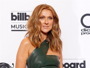 FILE - In this May 17, 2015 file photo, Celine Dion poses at the Billboard Music Awards in Las Vegas. Dion will honor the victims of the attacks in Paris at the American Music Awards on Sunday, Nov. 22, 2015. ABC and dick clark productions say that Dion will perform a rendition of Edith Piafs "Hymne à LAmour" in French at the ceremony to pay tribute to those affected by last week's attacks. (Photo by Eric Jamison/Invision/AP, FIle)