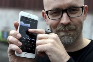 Kari Kivela, head of design at Ouraring, promoting a "wellness" ring at the Slush 2015 event in Helsinki, Thursday, Nov. 12, 2015. Slush is the focal point for startups and tech talent to meet with top-tier international investors, executives and media. (Jussi Nukari /Lehtikuva via AP)  FINLAND OUT
