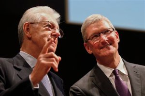 Apple CEO Tim Cook, right, listens to  former Italian premier and President of Bocconi University Mario Monti as they attend the inauguration of the academic year at the Bocconi, in Milan, Italy, Tuesday, Nov.10, 2015. (AP Photo/Luca Bruno)