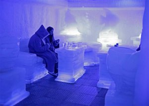Tourists cool off in the Ice Bar in the Red Sea resort town of Sharm el-Sheikh, where thousands of visitors are waiting to be evacuated, in south Sinai, Egypt, Sunday, Nov. 8, 2015. British Foreign Secretary Philip Hammond said Sunday that airport security in many cities will need to be overhauled if it is confirmed the Russian plane crash in the Sinai on Oct. 31, 2015 was caused by a bomb planted by the Islamic State group or someone inspired by the militants. (AP Photo/Ahmed Abd el-Latif)