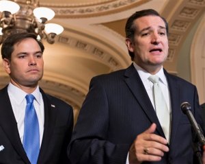 FILE - In this Sept. 27, 2013 file photo, Sen. Ted Cruz, R-Texas, right, accompanied by Sen. Marco Rubio, R-Fla., speaks on Capitol Hill in Washington. Republican presidential rivals Rubio and Cruz are backpedaling furiously as they try to outmaneuver each other on immigration. Rubio co-wrote a massive 2013 immigration bill that passed the Senate. He disavows it now, but Cruz wont stop talking about it.  (AP Photo/J. Scott Applewhite, File)