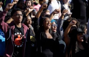 FILE - In this Nov. 9, 2015, file photo, students cheer while listening to members of the black student protest group Concerned Student 1950 speak following the announcement that University of Missouri System President Tim Wolfe would resign at the university in Columbia, Mo. In the ouster of the Missouris president, leaders of student groups on other campuses dealing with racial strife see an opening to press their own university administrators for better treatment of black students. (AP Photo/Jeff Roberson, File)