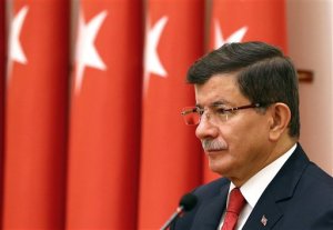 Turkish Prime Minister Ahmet Davutoglu attends an annual meeting of High Military Council  in Ankara, Turkey, Thursday, Nov. 26, 2015. Davutoglu is seeking to reduce tensions with Moscow, saying that Russia is Turkeys friend and neighbor and insisting relations cannot be sacrificed to accidents of communication. Davutoglu said on Wednesday that Turkey didnt know the nationality of the plane that was brought down at the border with Syria on Tuesday until Moscow announced it was Russian.(AP Photo/Prime Minister's Press Service, Pool)