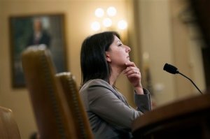 Dr. Mandy Cohen, chief of staff, Centers for Medicare and Medicaid Services, testifies on Capitol Hill in Washington, Tuesday, Nov. 3, 2015, before the House Health subcommittee hearing on the state of the health care CO-OP Program. The Obama administration defended the health care laws struggling insurance co-ops Tuesday, suggesting to Congress that cutbacks demanded by lawmakers themselves put added pressure on an altruistic alternative to mega-insurers.  (AP Photo/Cliff Owen)