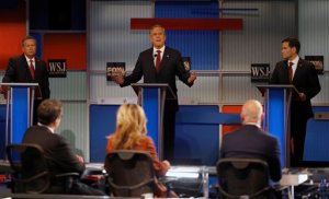 Jeb Bush speaks as John Kasich, left, and Marco Rubio listen during Republican presidential debate at Milwaukee Theatre, Tuesday, Nov. 10, 2015, in Milwaukee. (AP Photo/Morry Gash)