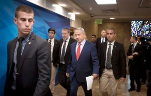 Israeli Prime Minister Benjamin Netanyahu arrives for the weekly cabinet meeting in Jerusalem, Sunday, Nov. 29, 2015. (Dan Balilty/Pool Photo via AP)