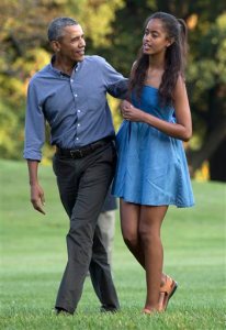 In this photo taken Aug. 23, 2015, President Barack Obama and his daughter Malia walk across the South Lawn of the White House in Washington from Marine One. The 17-year-old is among the millions of U.S. high school seniors who are nervously taking standardized tests, completing college admissions applications, filling out financial aid forms and writing personal essays, all on deadline, before spending the coming months anxiously waiting to find out if they got into their dream school. (AP Photo/Carolyn Kaster)