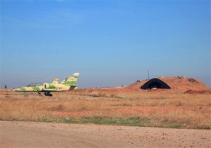 In this photo released by the Syrian official news agency SANA, shows warplanes inside the Kweiras air base, east of Aleppo, Syria, Wednesday, Nov. 11, 2015. Syrian government forces broke a siege imposed by the Islamic State group on the northern military air base of Kweiras since 2013. The international community is mounting its most serious effort yet to end the nearly five-year-old Syrian war, rallying around a second round of talks in Vienna this week amid the emergence of a Russian proposal that calls for early elections. (SANA via AP)