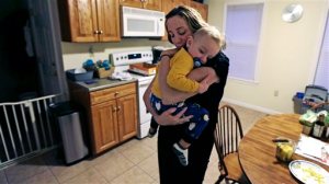Cancer survivor Christine Ells embraces her twenty-month-old son Jameson after arriving home from work in Whitman, Mass., Monday, Nov. 9, 2015. Ells, 36, a teacher in the Boston suburb of Quincy, developed a heart rhythm problem from several drugs she was given to treat the breast cancer she was diagnosed with at age 27. Certain cancer drugs, such as Herceptin and doxorubicin, sold as Adriamycin and other brands, can hurt the heart's ability to pump, and lead to heart failure. (AP Photo/Charles Krupa)