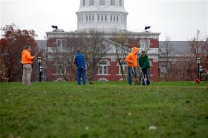 University of Missouri grounds maintenance workers begin to clean up Mel Carnahan Quad on the University of Missouri campus Wednesday, Nov.11, 2015, in Columbia, Mo. The Concerned Student 1950 activist group tent city was disassembled overnight after both the University system president and the chancellor resigned. (John Happel/Columbia Missourian via AP)