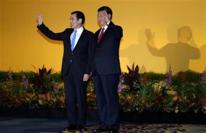 Chinese President Xi Jinping, right, and Taiwanese President Ma Ying-jeou, left, shake hands at the Shangri-la Hotel on Saturday, Nov. 7, 2015, in Singapore. The two leaders shook hands at the start of a historic meeting marking the first top level contact between the formerly bitter Cold War goes since they split amid civil war 66 years ago. (AP Photo/Wong Maye-E)