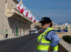 Police officers patrol outside the Mediterranean Conference Centre where an informal European Union and African leaders summit on migration will be held in Valletta, Malta, Wednesday, Nov. 11, 2015. The meeting of leaders is to map strategy to beef up development project aid in Africa and set up mechanisms to repatriate migrants Europe says don't deserve its protection. (AP Photo/Alessandra Tarantino)