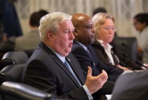 Department of Veterans Affairs employees, from left, Principal Deputy Under Secretary for Benefits Danny Pummill, Baltimore Regional Office Director Antione Waller, and Department of Veterans Affairs Deputy Inspector General Linda Halliday appear at a Veterans Affairs Committee hearing on Capitol Hill in Washington, Monday, Nov. 2, 2015.  (AP Photo/Molly Riley)