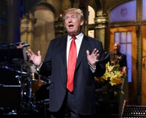FILE - In this Nov. 7, 2015 file photo released by NBC, Republican presidential candidate Donald Trump speaks during the monologue as he guest hosts on "Saturday Night Live." The show averaged 9.3 million viewers, according to final Nielsen figures released Thursday, Nov. 12.  (Dana Edelson/NBC via AP)