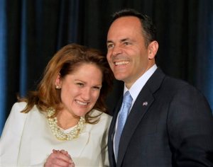 Kentucky Republican Gov.-elect Matt Bevin, right, and his wife Glenna react to the cheers of supporters during his introduction at the Republican Party victory celebration, Tuesday, Nov. 3, 2015, in Louisville, Ky. Bevin has defeated Democrat Jack Conway to become only the second Republican governor in the state in four decades. (AP Photo/Timothy D. Easley)