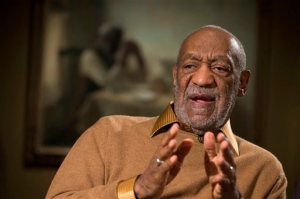 FILE - In this Nov. 6, 2014 file photo, entertainer Bill Cosby gestures during an interview at the Smithsonian's National Museum of African Art in Washington. The California State University system has become the latest to take back an honorary degree from Cosby. The Board of Trustees voted Friday, Nov. 20, 2015, to revoke an honorary doctorate given to Cosby by Cal Poly Pomona in 1992. (AP Photo/Evan Vucci, File)