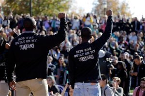 In this photo taken Nov. 9, 2015, members of the black student protest group, Concerned Student 1950, raise their arms while addressing a crowd following the announcement University of Missouri System President Tim Wolfe would resign, at the University of Missouri in Columbia, Mo. On the campaign trail, among candidates of both parties, the idea of locking up drug criminals for life is a lot less popular than it was a generation ago. The 2016 presidential race has accelerated an evolution away from the traditional tough-on-crime candidate. A Republican Party thats long taken a law-and-order stance finds itself desperate to improve its standing among minority voters while Democratic candidates are also being drawn into national conversations on policing, drug crimes and prison costs. (AP Photo/Jeff Roberson)