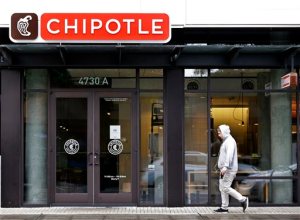 FILE - In this Nov. 2, 2015, file photo, a pedestrian walks past a closed Chipotle restaurant in Seattle. Washington state health officials say they have found no source for the E. coli outbreak related to Chipotle and the chain's Pacific Northwest restaurants could reopen later this week. Washington state epidemiologist Dr. Scott Lindquist says all the tests of food from Chipotle stores in Washington and Oregon came back negative for E. coli. (AP Photo/Elaine Thompson, File)