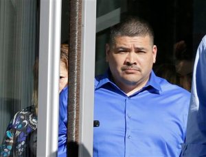 FILE - In this April 16, 2015, file photo, Raymond Fryberg walks out of the Federal Courthouse in Seattle. Several American Indian tribes are gaining access to national criminal databases after a deadly shooting in Washington state helped reveal flaws in the way federal authorities and tribal governments share information, which allowed the member of the Tulalip Tribe, Fryberg, to buy a gun that was later used by his son. The program allows tribes to conduct thorough background checks and enter criminal records, the U.S. Department of Justice said Thursday, Nov. 5, 2015. (AP Photo/Ted S. Warren, File)
