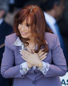 Argentina's President Cristina Fernandez places her hand on her chest as she acknowledges supporters after an event to inaugurate medical services at a public hospital in Moron, on the outskirts of Buenos Aires, Argentina, Wednesday, Nov. 25, 2015. The South American leader steps down Dec. 10 after eight years in the presidential office. Fernandez, 62, has said little about her future, other than repeatedly promising not to go away. (AP Photo/Ricardo Mazalan)