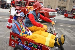 The Detroit Fire Department Clown Team zig-zags down Woodward Ave. during the 89th America's Thanksgiving Parade presented by Art Van in Detroit's Midtown on Thursday, Nov. 26, 2015. (Tanya Moutzalias/MLive Detroit via AP)