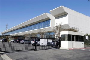 This Friday, Nov. 6, 2015 photo shows the Faraday Future building in Gardena, Calif. Faraday Future has been hunting for a place to build what it says will be a $1 billion manufacturing plant for a new line of cars. Four states are contenders and the company says to expect an announcement within weeks.  Like Tesla, Faradays car will be all-electric, and debut at the high end.  (AP Photo/Nick Ut)