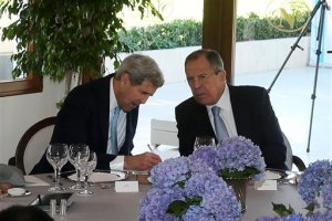 U.S. Secretary of State John Kerry, left, takes notes as he talks with Russian Foreign Minister Sergey Lavrov, at the G-20 summit in Antalya, Turkey, Sunday, Nov. 15, 2015.  The 2015 G-20 Leaders Summit is held near the Turkish Mediterranean coastal city of Antalya on Nov. 15-16, 2015. (Anadolu Agency via AP, Pool)