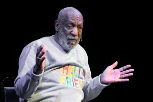 FILE - In this Friday, Nov. 21, 2014, file photo, comedian Bill Cosby performs at the Maxwell C. King Center for the Performing Arts, in Melbourne, Fla. On Thursday, Oct. 15, 2015, both Tufts University in Massachusetts and Goucher College in Maryland rescinded honorary degrees previously awarded to Cosby by the respective institutions. (AP Photo/Phelan M. Ebenhack, File)