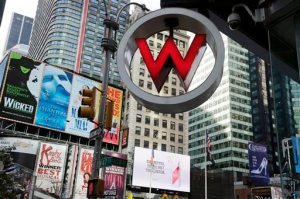 FILE  - In this Wednesday, July 31, 2013, file photo, the logo for the W Hotel, owned by Starwood Hotels & Resorts Worldwide, is seen in New York's Times Square. Marriott International announced Monday, Nov. 16, 2015, it is buying rival hotel chain Starwood for $12.2 billion in a deal that will secure its position as the world's largest hotelier. (AP Photo/Mark Lennihan, File)