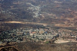 FILE - In this Sept. 20 2010 aerial file photo, taken through the window of an airplane shows the West Bank Jewish settlement of Ariel . .Relations between the European Union and Israel took a dive on Wednesday, Nov. 11, 2015 after Jerusalem derided a decision of the 28-nation bloc to specially label products made in West Bank settlements.(AP Photo/Ariel Schalit, File)