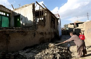 An Afghan man clears rubble from a damaged house following a strong earthquake, in Kabul, Afghanistan, Monday, Oct. 26, 2015. The U.S. Geological Survey said the epicenter of the 7.5-magnitude earthquake was in the Hindu Kush mountains, in the sparsely populated province of Badakhshan, which borders Pakistan, Tajikistan and China. It said the epicenter was 213 kilometers (130 miles) deep and 73 kilometers (45 miles) south of the provincial capital, Fayzabad. (AP Photo/Rahmat Gul)