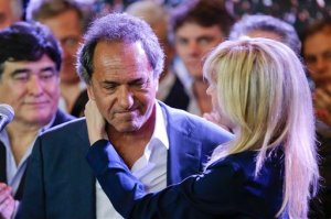 Daniel Scioli, the ruling party presidential candidate, is hugged by his wife Karina Rabolini after he delivered his concession speech to opposition candidate Mauricio Macri during Argentina's runoff presidential election in Buenos Aires,  Sunday, Nov. 22, 2015. Macri has won Argentina's historic runoff election, putting an end to the era of President Cristina Fernandez, who along with her late husband dominated the political scene and rewrote the country's social contract. (AP Photo/Ivan Fernandez)