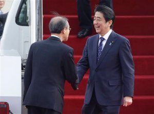 Japanese Prime Minister Shinzo Abe, right, shakes hands with South Korean first vice foreign minister Lim Sung-nam upon his arrival at Seoul Airport in Seongnam, South Korea, Sunday, Nov. 1, 2015. The leaders of South Korea, China and Japan are set to meet for their first summit talks in more than three years as they struggle to mend deep animosities centering on history and territory. (AP Photo/Ahn Young-joon)