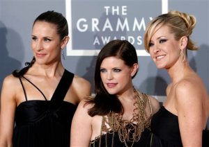 FILE - In this Feb. 11, 2007, file photo, the Dixie Chicks, Emily Robison, left, Natalie Maines, center, and Martie Maguire, who earned five Grammy nominations, arrive for the 49th Annual Grammy Awards in Los Angeles. The Dixie Chicks are ready to party in the USA with a summer 2016 tour. The Grammy-winning group will kick off its DCX MMXVI World Tour on June 1, 2016, in Cincinnati. It wraps in Los Angeles on Oct. 10, 2016. The group will visit more than 40 cities, including New York, Chicago, San Francisco, Detroit, Dallas and Toronto. The Dixie Chicks' North American tour will follow the group's European tour that begins in April. (AP Photo/Matt Sayles, File)