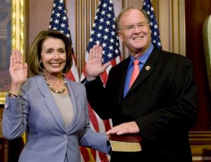 FILE - In this Jan. 6, 2009, file photo, House Speaker Nancy Pelosi of Calif., left, stands with Rep. Sam Farr, D-Calif., during a mock swearing in on Capitol Hill in Washington. Farr says he'll retire at the end of his term, ending a career in Congress spanning more than two decades. The 74-year-old made the announcement Thursday, Nov. 12, 2015, in Salinas, Calif. Farr represents the 20th congressional district which includes the Central Coast. He is the ranking member on the House Appropriations Subcommittee on Agriculture. (AP Photo/Haraz N. Ghanbari, File)