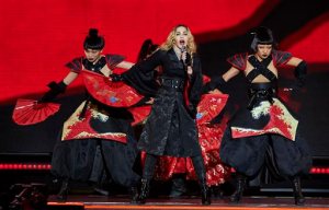 FILE - In this Sept. 16, 2015 file photo, Madonna performs in concert at New York's Madison Square Garden in New York. Idris Elba is co-starring with Madonna on stage - not screen. The actor-musician will be the opening act during her "Rebel Heart" tour stop Tuesday, Nov. 10, 2015, at the Mercedes Benz Arena in Berlin, Germany.  (Photo by Robert Altman/Invision/AP, File)