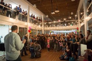 FILE - In this Monday, Nov. 9, 2015, file photo, Weston Clark speaks to a crowd during a rally to celebrate all families, sponsored by Equality Utah and the Utah Pride Center, in Salt Lake City. A new Mormon church policy targeting gay members and their children has triggered a firestorm of backlash from church members of all political backgrounds. The new rules bar children living with gay parents from being baptized until they're 18. After that, they can be baptized only if they disavow same-sex relationships. The rules also make gay marriages a sin worthy of expulsion. (Rick Egan/The Salt Lake Tribune via AP, File) DESERET NEWS OUT; LOCAL TELEVISION OUT; MAGS OUT; MANDATORY CREDIT