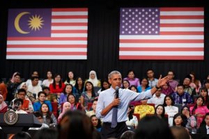 U.S. President Barack Obama gestures as he speaks at the Young Southeast Asian Leaders Initiative (YSEALI) town hall meeting at Taylor's University in Kuala Lumpur, Malaysia, Friday, Nov. 20, 2015. Obama urged young people in predominantly Muslim Malaysia on Friday to reject the terrible vision that drove the Paris attacks, offering an alternative vision in which traditional cultures coexist with a diverse modern world. (AP Photo/Vincent Thian)