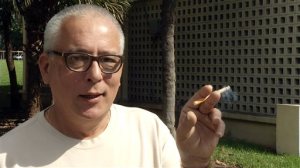 In this image taken from AP Video, Gerardo Barro, a resident of the Robert King High Towers, a public housing complex near the Miami's Marlins Park baseball stadium speaks to a reporter, Thursday, Nov, 12, 2015, in Miami. Smoking could soon be banned in public housing nationwide, even inside peoples apartments.  The Department of Housing and Urban Development proposed a rule Thursday that would require the more than 3,100 public housing agencies across the country to make their properties smoke-free. (Tony Winton/AP Video via AP)