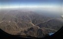 The mountains of south Sinai are viewed from the window during a flight to Cairo from Sharm el-Sheik, Egypt, Monday, Nov. 9, 2015. Russian news agencies are quoting Dmitry Gorin, vice president of the Russian Travel Agencies Association, as saying the number of Russian tourists brought home from Egypt is likely to reach 23,000 by mid-day. Their returns come after last week's announcement that Russia was suspending new passenger flights to Egypt because of security concerns in the aftermath of the Oct. 31 plane crash. (AP Photo/Thomas Hartwell)