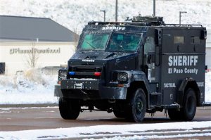 An El Paso County Sheriff's tactical response vehicle leaves the scene on Sunday, Nov. 29, 2015, in Colorado Springs, Colo., after Friday's deadly shooting at a Planned Parenthood clinic. (Daniel Owen/The Gazette via AP) MAGS OUT; MANDATORY CREDIT