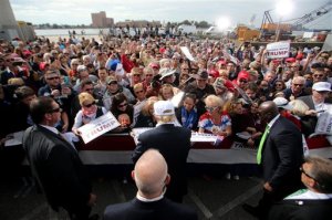 Republican presidential candidate Donald Trump signs autographs for supporters during a rally, Saturday, Oct. 31, 2015 in Norfolk, Va. (AP Photo/Jason Hirschfeld)