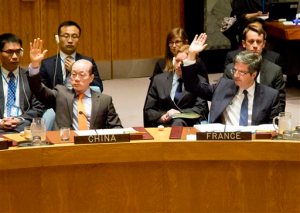 China U.N. Ambassador Liu Jieyi, left, and France U.N. Ambassador Francois Delattre, raise their hands during a U.N. Security Council vote on a French-sponsored counter terrorism resolution, aimed at Islamic extremist, Friday, Nov. 20, 2015 at U.N. headquarters. The Security Council unanimously approved the resolution, calling on all nations to redouble and coordinate action to prevent further attacks by Islamic State terrorists and other extremist groups. (AP Photo/Bebeto Matthews)
