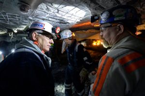 FILE- In this Jan. 13, 2015 file photo, Joe Main, left, Assistant Secretary of Labor for Mine Safety and Health, speaks with Jim Newton, a worker at the Gibson North mine in Princeton, Ind.  Main said that black lung is more widespread among coal miners than data shows. Beginning Feb. 1, 2016, the Mine Safety and Health Administration will require coal operators to increase the number of air samples taken in underground mines. The agency also will require miners working in the dustiest underground conditions to wear personal devices that give real-time readings on air quality. (AP Photo/Timothy D. Easley, File)