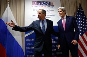 Russian Foreign Minister Sergei Lavrov, left, invites U.S. Secretary of State John Kerry to a sitting area as he arrives for their bilateral alongside the OSCE Ministerial Council meeting in Belgrade, Serbia, Thursday,  Dec. 3, 2015. Foreign Ministers attended the opening session at the Organisation for Security and Cooperation in Europe (OSCE) summit in Belgrade on Thursday.  (Jonathan Ernst, Pool Photo via AP)
