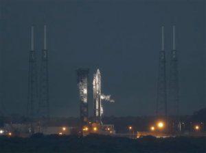 A United Launch Alliance Atlas V rocket stands ready shortly before a launch attempt was scrubbed due to poor weather conditions on launch complex 41at the Cape Canaveral Air Force Station, Thursday, Dec. 3, 2015, in Cape Canaveral, Fla. Another launch attempt is set for Friday. (AP Photo/John Raoux)