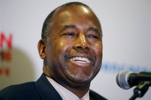 In this Nov. 23, 2015 photo, Republican presidential candidate, Dr. Ben Carson holds a news conference after a rally in Pahrump, Nev. For many African Americans _ the vast majority of them Democrats _ there are two Carsons: one a genius doctor, and an inspirational speaker and writer who talks of limitless horizons, and the other a presidential candidate whose conservative politics have rocketed him to the top of the Republican primary polls. (AP Photo/John Locher)